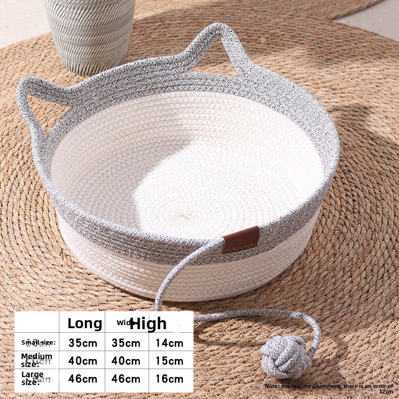 A round woven basket with two handles, shown on a woven placemat with a size chart overlay at the bottom left. The basket has a white woven body and a gray braided rim and handles, with a small brown leather accent on the side.